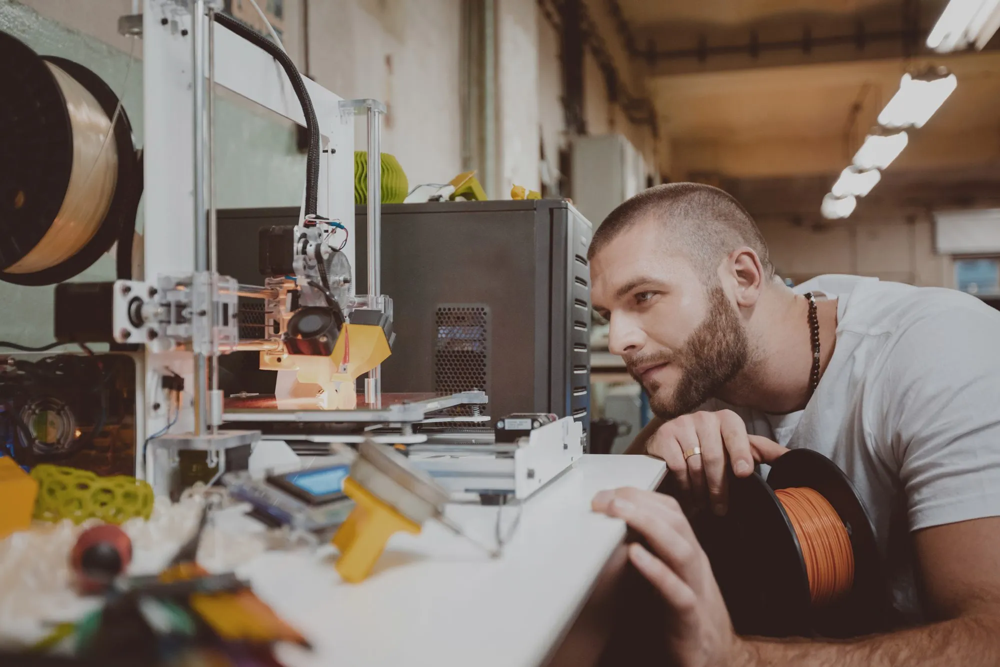 A member checks a print on the Ultimaker in the makerspace at Hone Limehouse