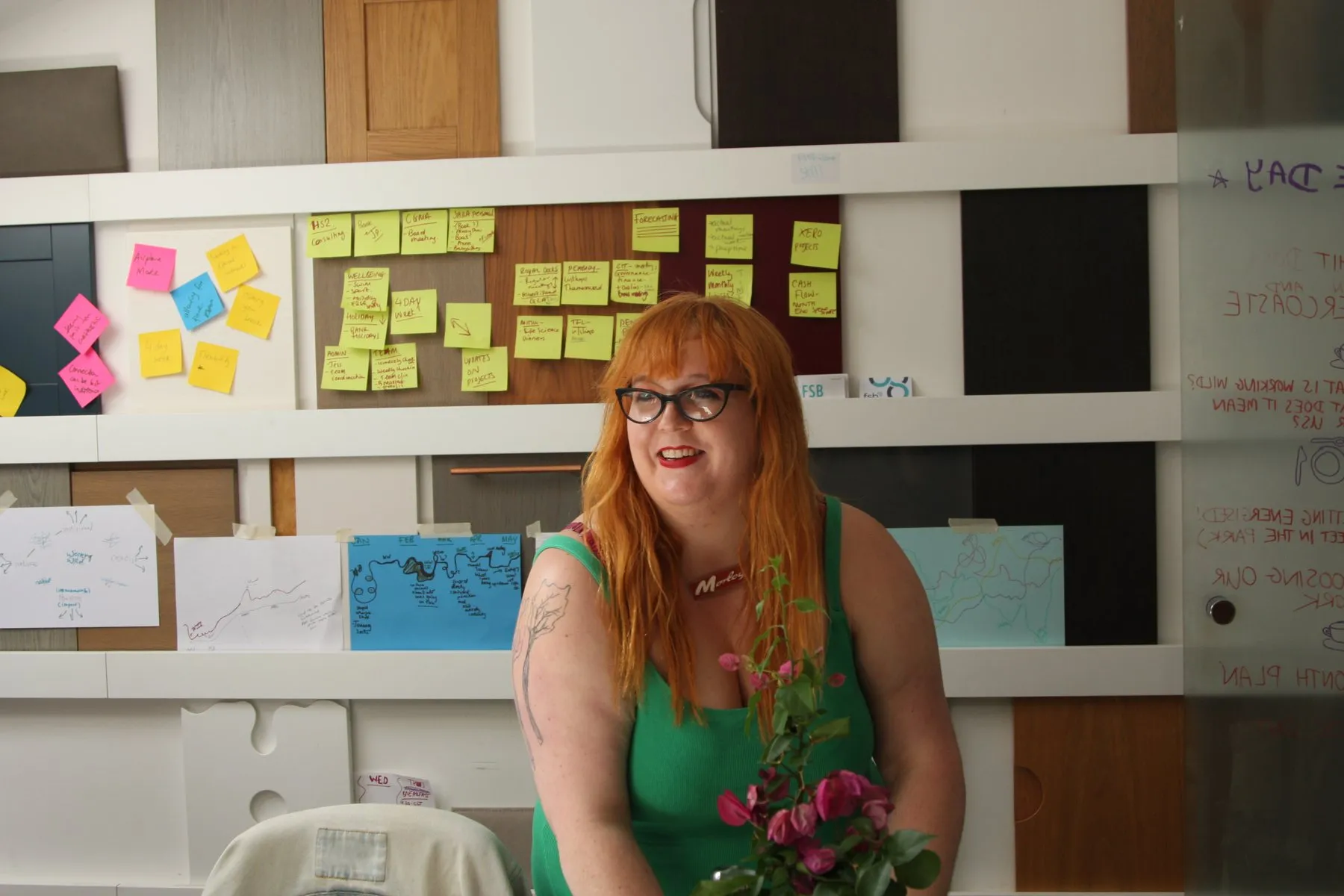 A designer at the samples wall in a studio office