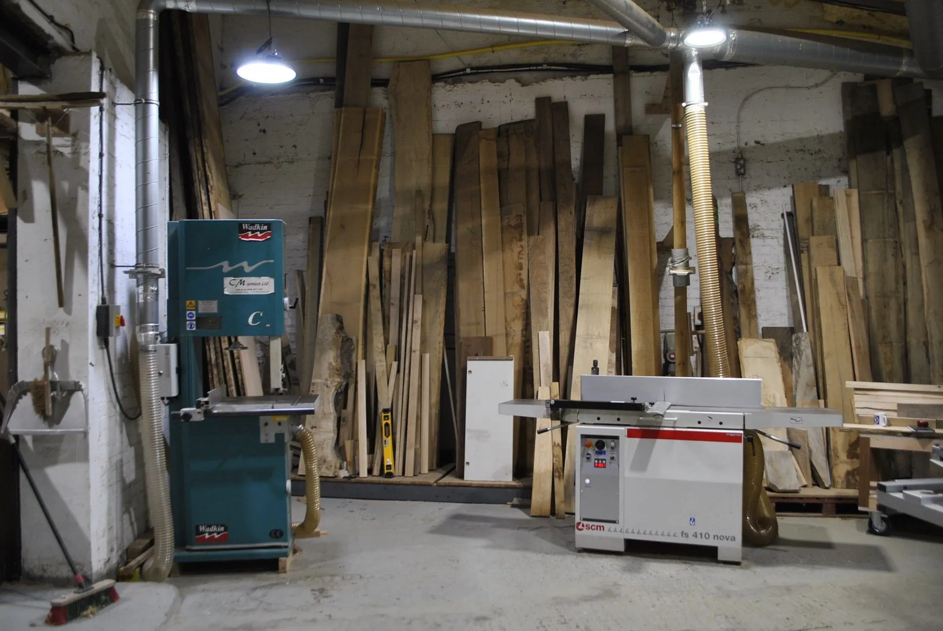 The bandsaw beside the timber store